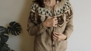Custom Knit Sweaters patterned cardigan with button-front construction and soft texture.
