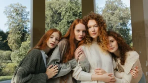 Group of women wearing soft knitwear styles for a full zip sweater collection concept