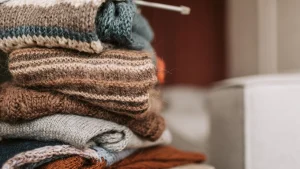 Folded zip up knit sweater styles with visible yarn texture and layered knitwear details
