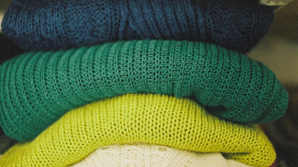 Colorful folded knitwear stack for Wholesale Cardigan Sweaters collection planning