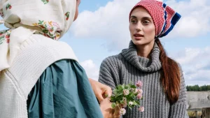 Woman wearing a gray ribbed Cotton Knitwear turtleneck sweater outdoors.