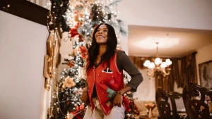 Red custom sweater vest worn with festive seasonal styling.