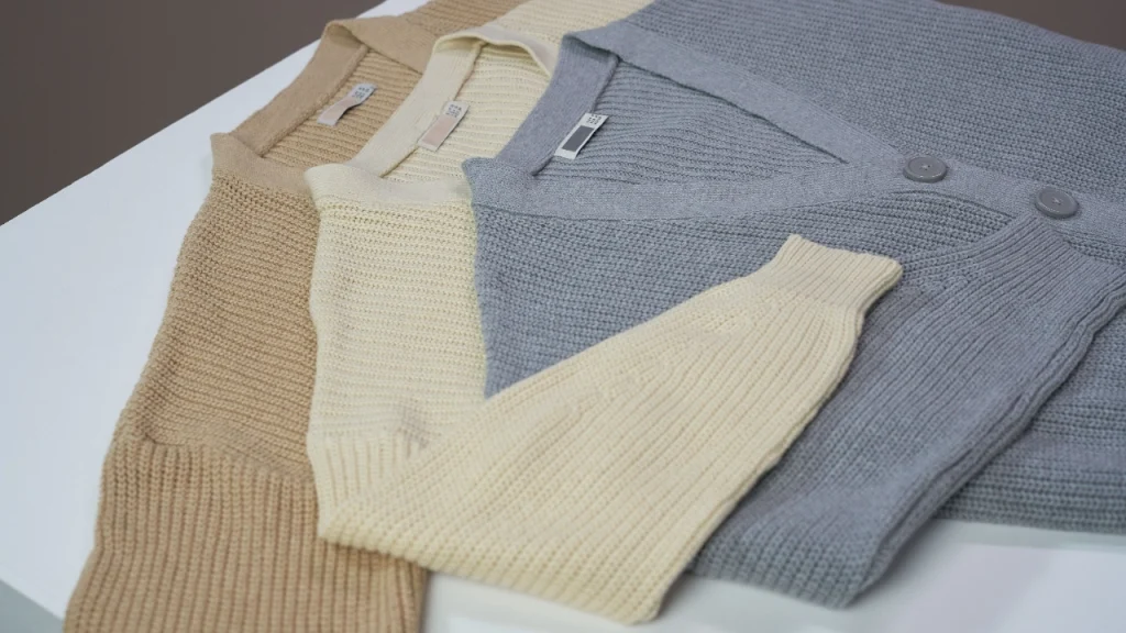 Folded knitwear garments prepared for pre production sample fit and quality review.