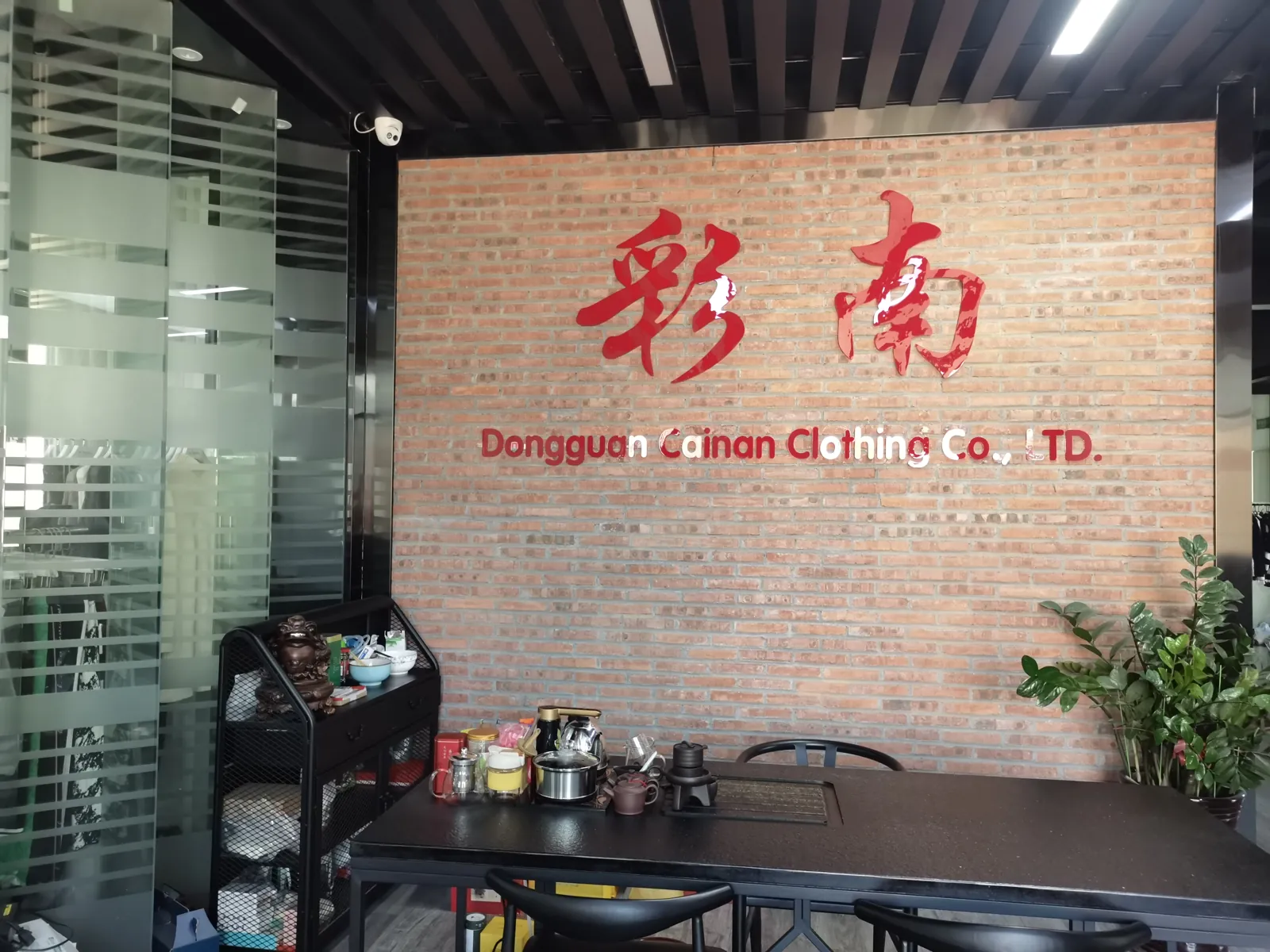 Cainan Clothing company logo wall in the office reception