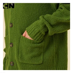 Close-up of cardigan patch pocket and buttons