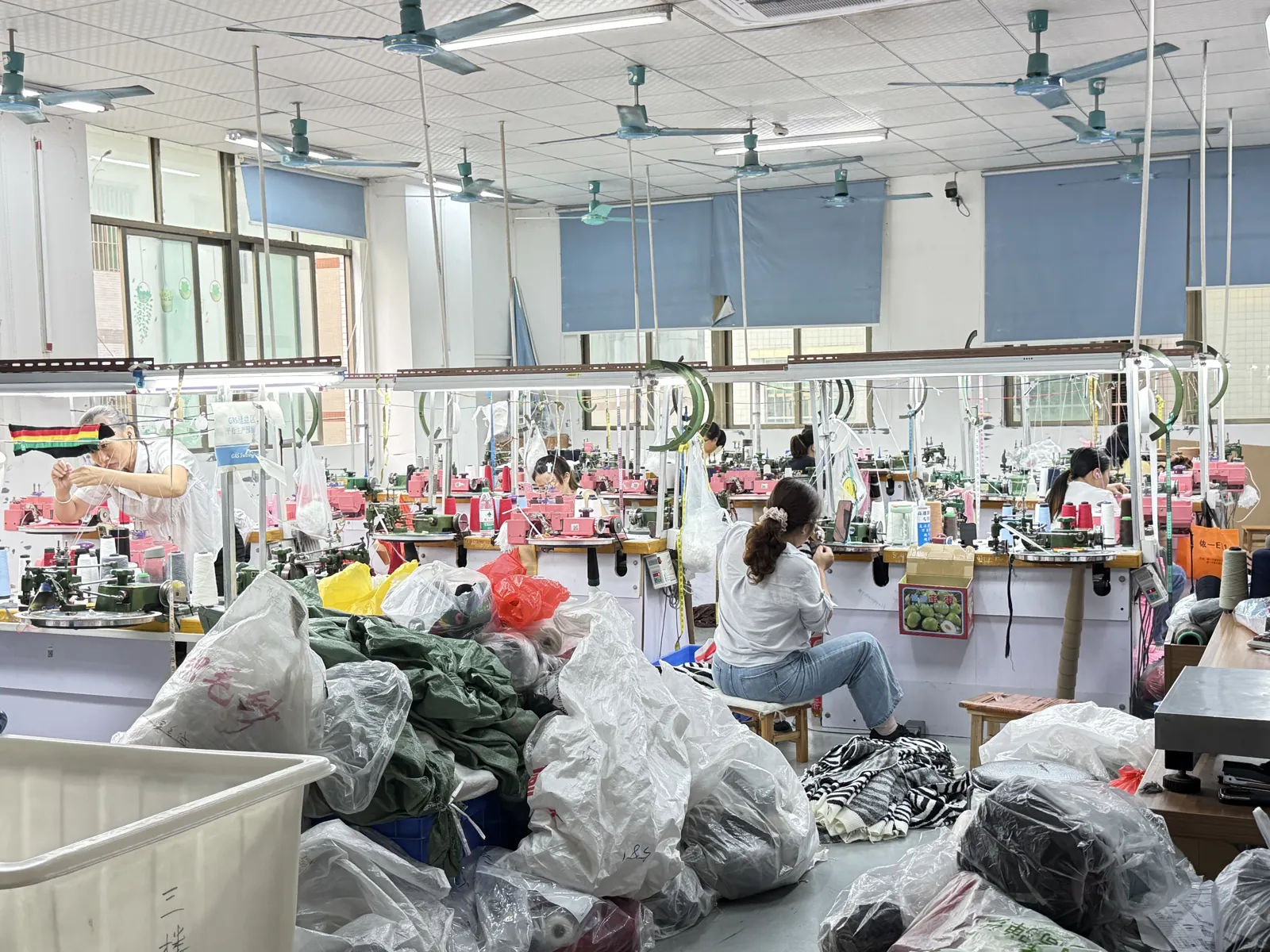 Hand mending and trimming area for knitted garments