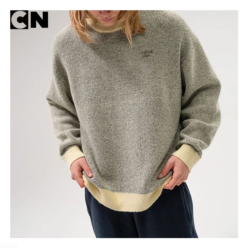 Close-up of a contrast rib hem on a knit sweater, the type of edge we use on a cropped sweater hem