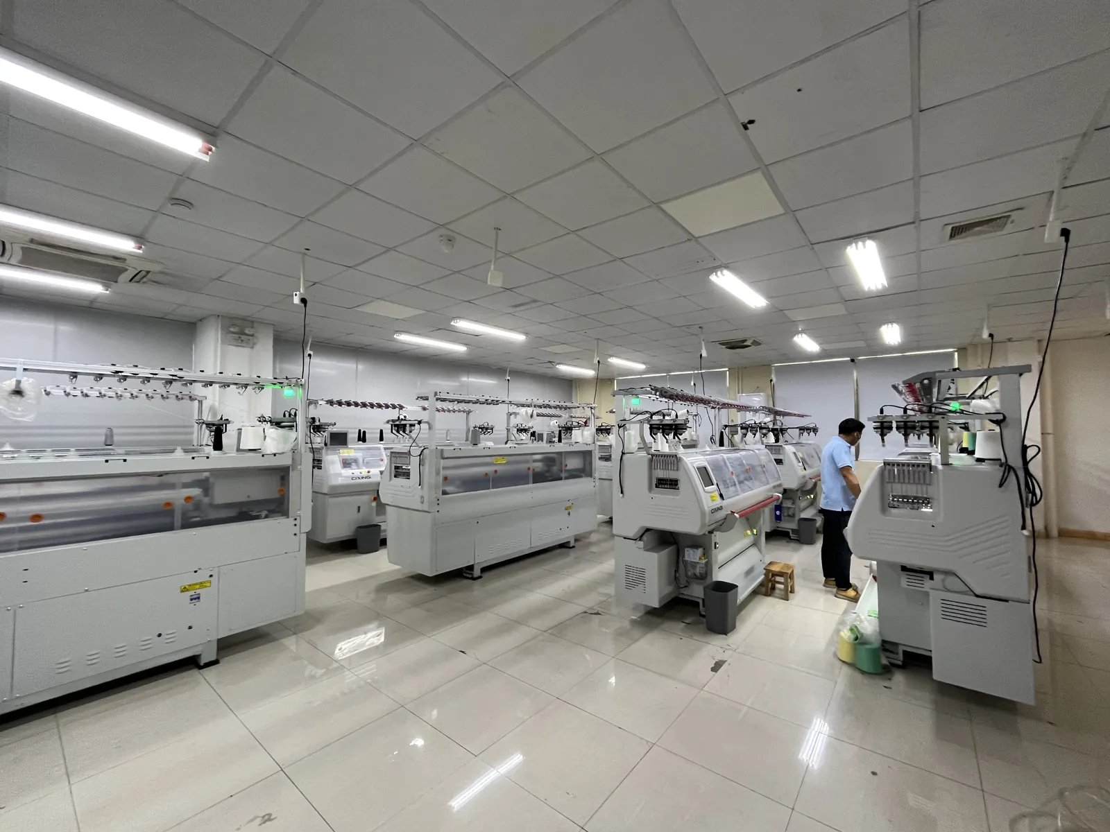 Wide view of the knitting workshop with computerized knitting machines