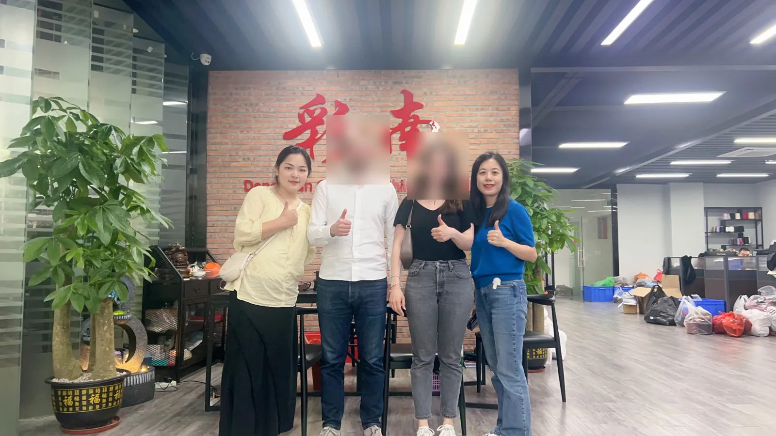 Overseas buyers visiting Cainan Clothing in Dongguan with the Cainan team