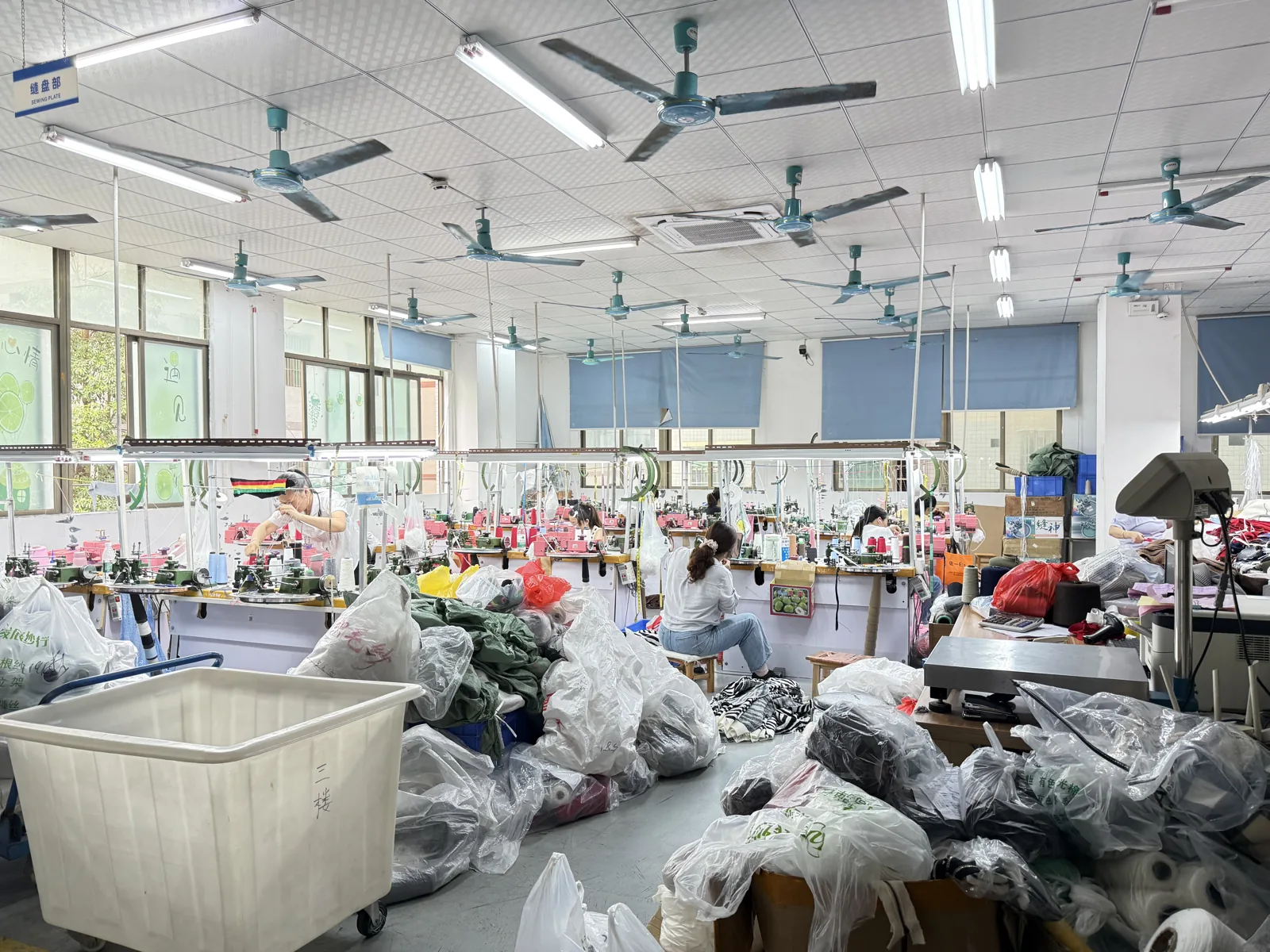 Finished sweaters in polybags on the finishing floor before packing