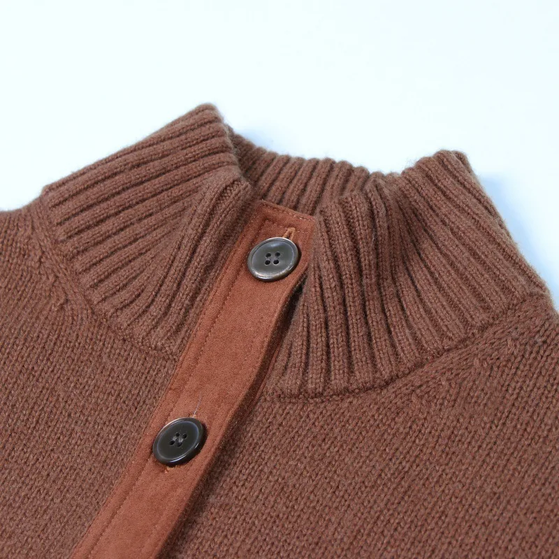 Rust ribbed knit placket with stand collar and buttons, showing band and buttonhole detail