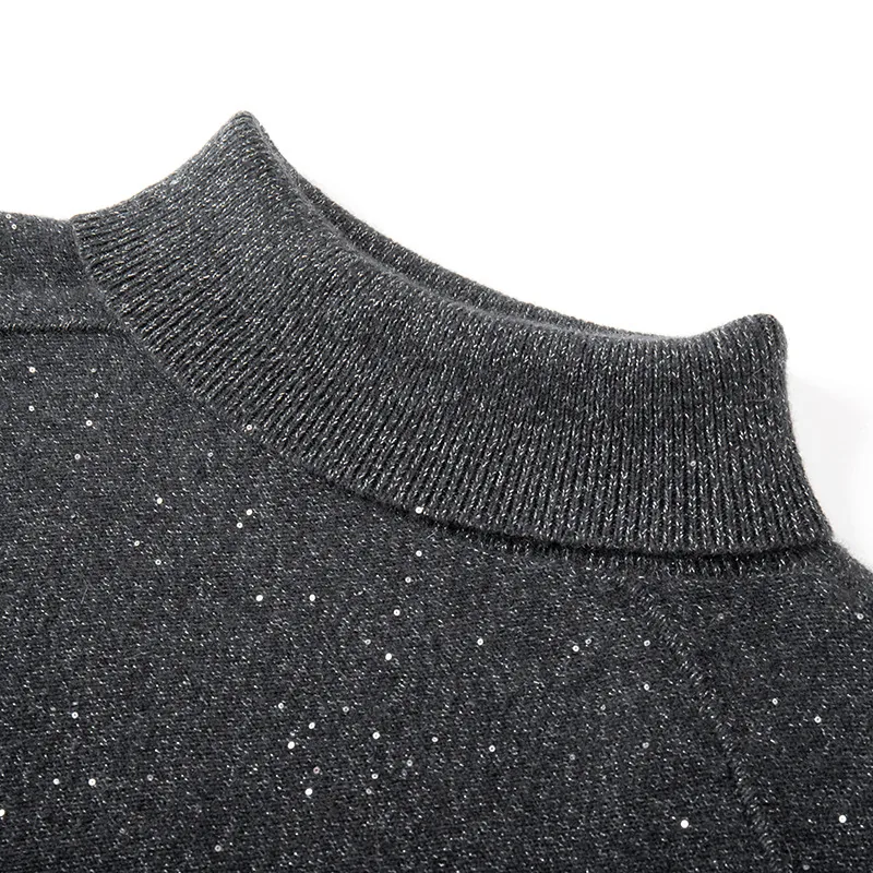 Collar and shoulder detail of a high neck knit sweater