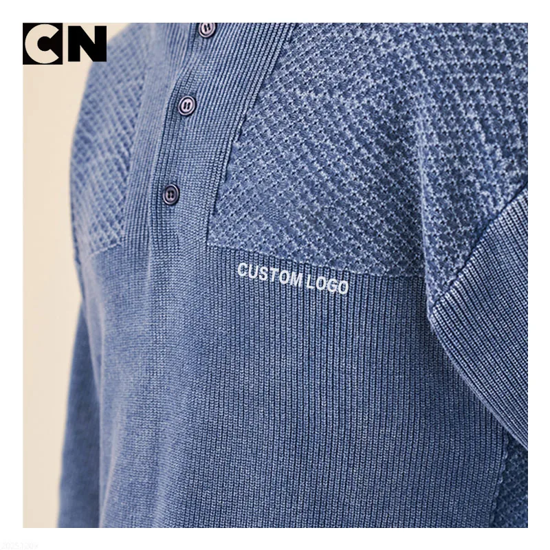 Woven logo label stitched into a textured panel knit sweater